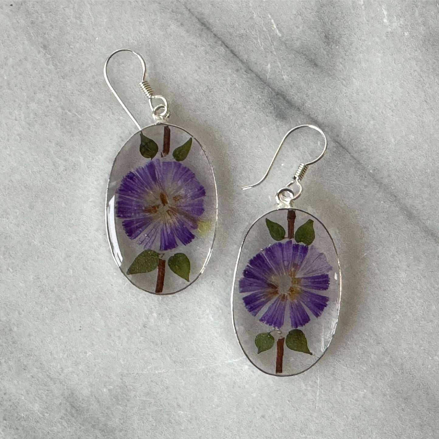 Alpaca Silver Oval with Purple Pressed Flower Dangle Earrings - Recetas Fair Trade